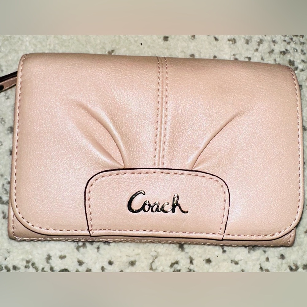 Coach Pink Wallet with Curved Design and Stitching